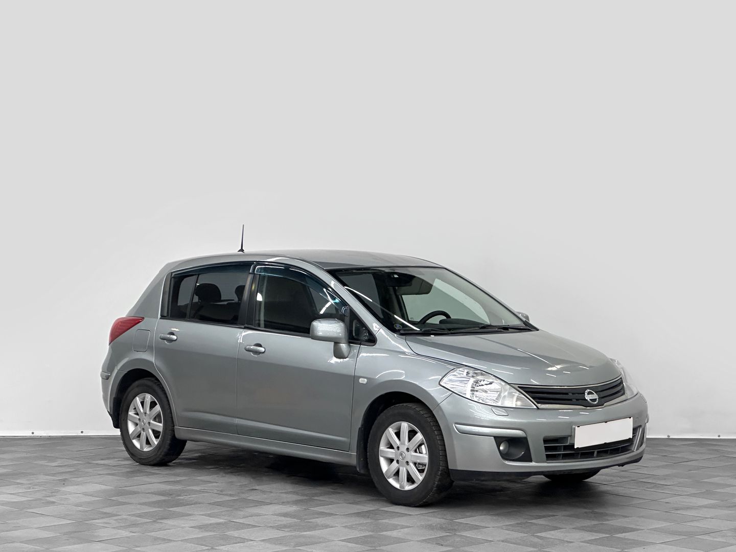 Nissan Tiida, I Рестайлинг 1.6 MT (110 л.с.)